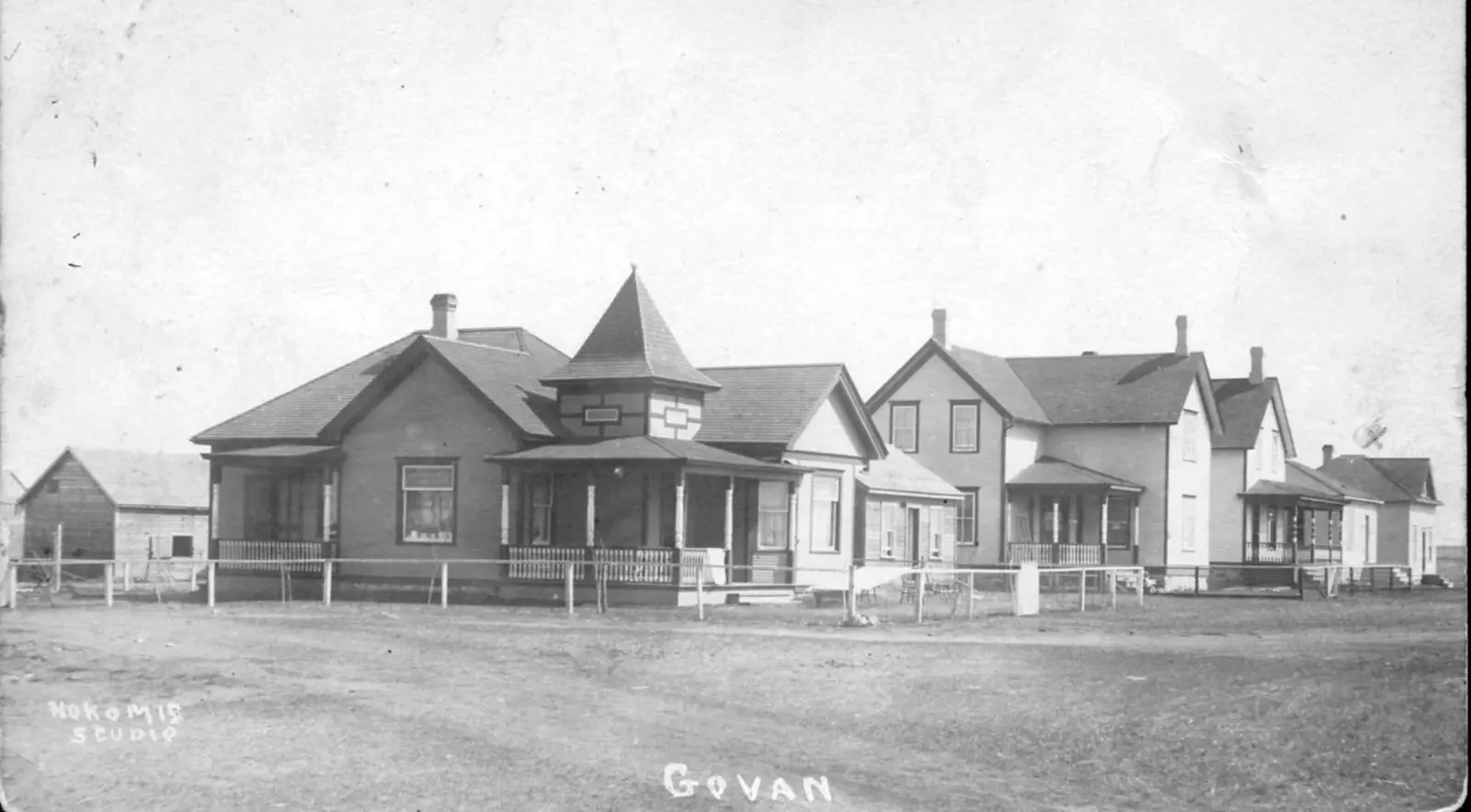 Row of houses along a dirt street in Govan